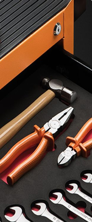Tramontina PRO tools: combination wrenches, pliers and hammer.