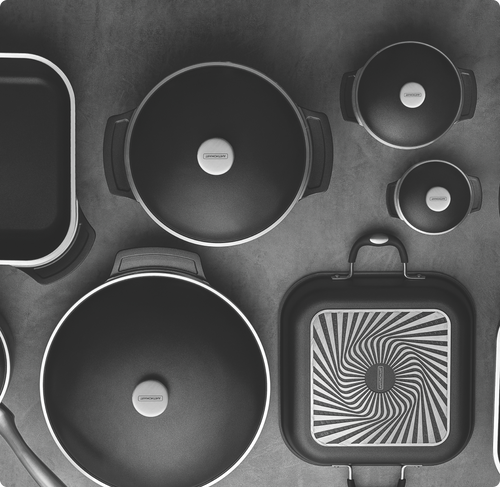 Black and white photo of Tramontina sauce pans.
